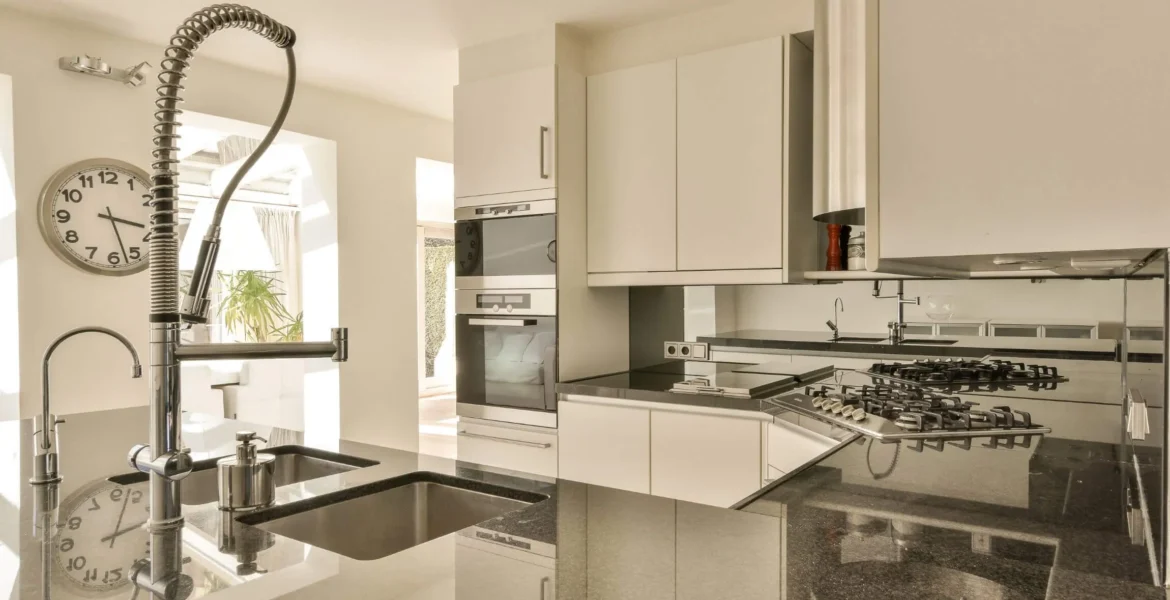 kitchen renovation 16 imgi_47_a-kitchen-with-white-cabinets-and-a-black-counter-2026-03-18-10-42-28-utc